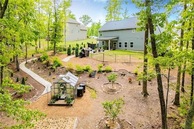 Rear view of property featuring fence