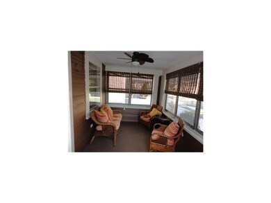 Sun Room. 3 seasons porch to greet your guests