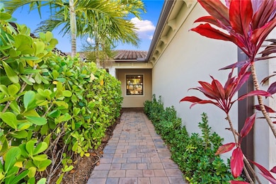 View of exterior entry with stucco siding