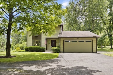 Attached 2-car garage and paved driveway