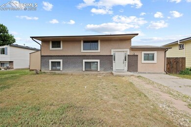 Split level home with stucco siding and brick siding