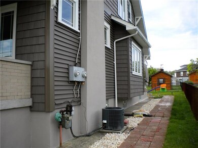 Side of home with walkway to back yard.