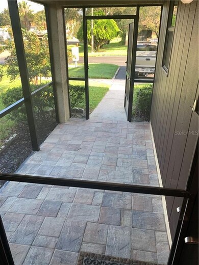 New pavers on screened porch leading up to the fro