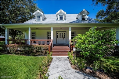 Country-style home featuring a porch