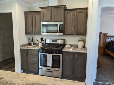 Kitchen Stove Area with built in microwave with ex