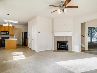 Unfurnished living room with a ceiling fan, light