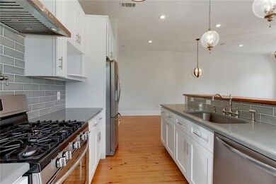 Kitchen with reclaimed barge board bar countertop