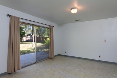 Living area looks out on lovely backyard