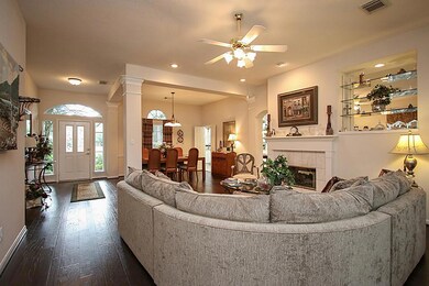 A view of the front door from the formal living area. Look at those hardwood floors.