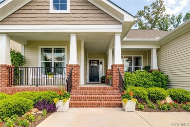 The front porch features two separate seating area