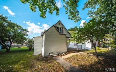 View of home's exterior featuring a yard
