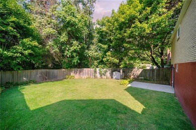 Enjoy this flat, completely fenced in back yard.