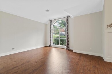 Unfurnished room featuring lofted ceiling, crown m