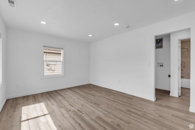 Unfurnished room with recessed lighting and light wood finished floors