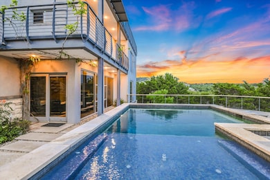 Pool at dusk with an outdoor pool