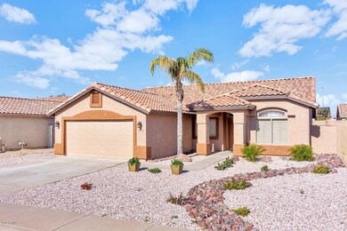 10772 W Louise Dr-large-003-23-Front Ext