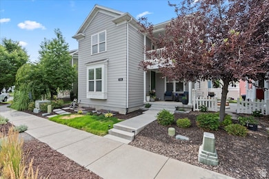 View of front facade with covered porch and a balcony