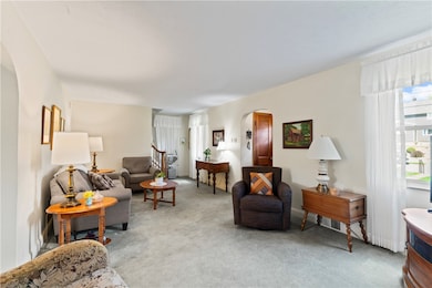This large living room features plenty of sunlight