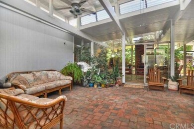 Entering though the signature Eichler carport you 