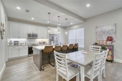 Dining room featuring recessed lighting, light woo