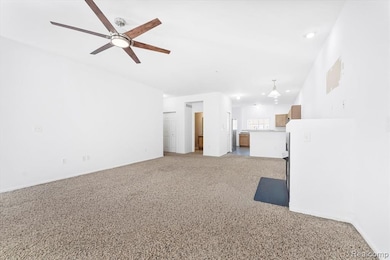 Unfurnished living room with light colored carpet, recessed lighting, and ceiling fan