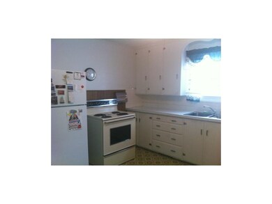 Cabinets reach to ceiling providing ample storage,