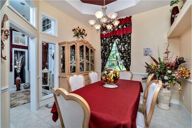 Formal Dining room has tiled flooring, tray ceilin