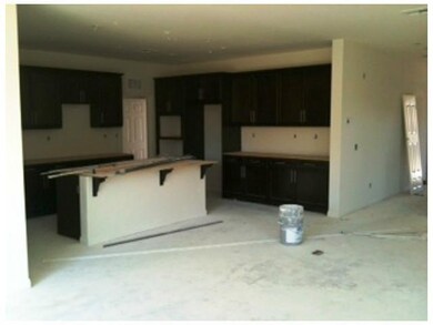 Home is under construction- rich dark cabinets and spacious island that is open to great room.  Sept move in date.