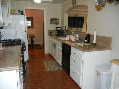 This gourmet kitchen looks into the family room. Q
