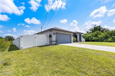 View of front of home with concrete driveway, a ga