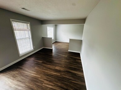 Unfurnished room with visible vents, baseboards, a