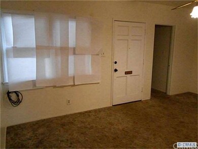 Family Room with Interior view of Front Door and M