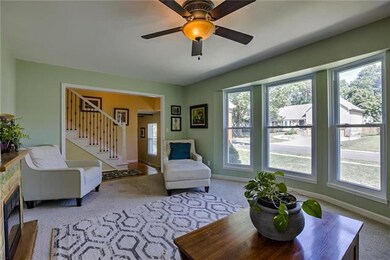 Formal living room with huge bay windows.