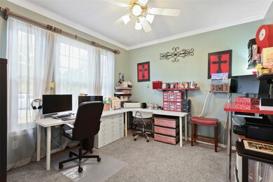This private home office is tucked behind French doors off of the entry. It's ideal for the at-home professional with plush carpet, decorator paint, crown molding, a lit ceiling fan and great natural light.