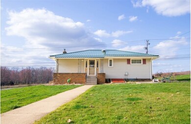 The back has a covered back porch, Bilco doors to