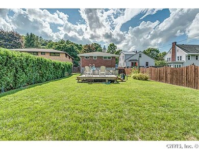 Backyard. The backyard is private with a shrub wal