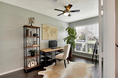 Large spacious study with gorgeous wood floors.