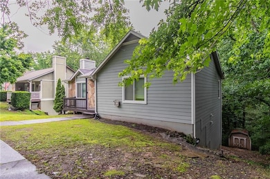 View of front of house featuring a front lawn and a chimney