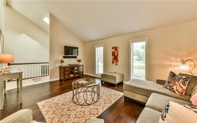 Living Room and Entry with a view of the staircase