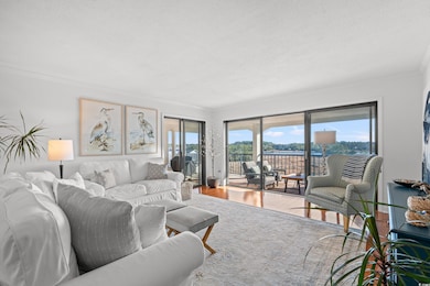 Living room with wood finished floors and ornamental molding