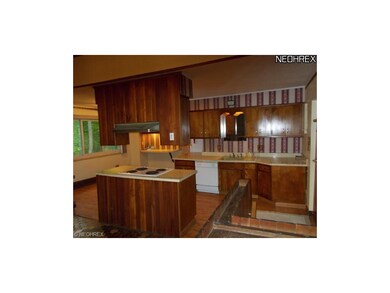 Front entrance on the right leads to the kitchen. 