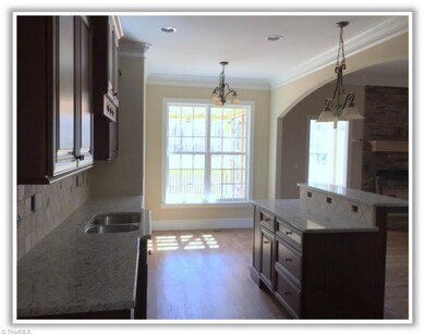 Side view with kitchen island for bar seating.