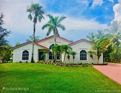 This home has a gorgeous healthy lawn and nice cur