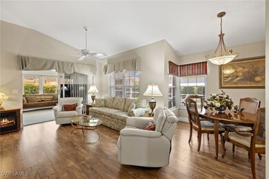 Living area with a ceiling fan, vaulted ceiling, w