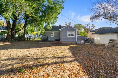 Back of property with a patio and a chimney