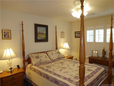 1st Floor Master Bedroom with Plantation Shutters and Ceiling Fan