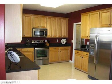 Kitchen. Kitchen has a newer stainless microwave, dishwasher and slide in range.