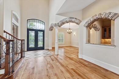 This spacious entryway features a grand staircase