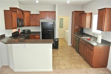 Efficient kitchen with good counter and storage sp
