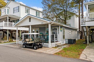 View of front of home with central AC unit, stairw